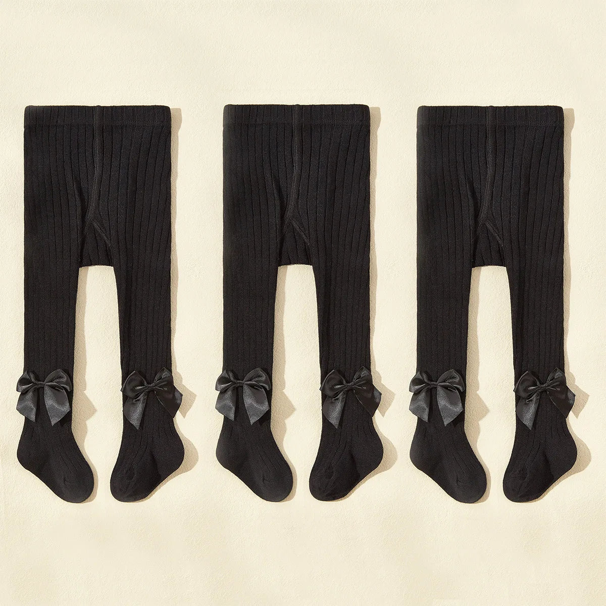 Strumpbyxor med rosett i 3-pack
