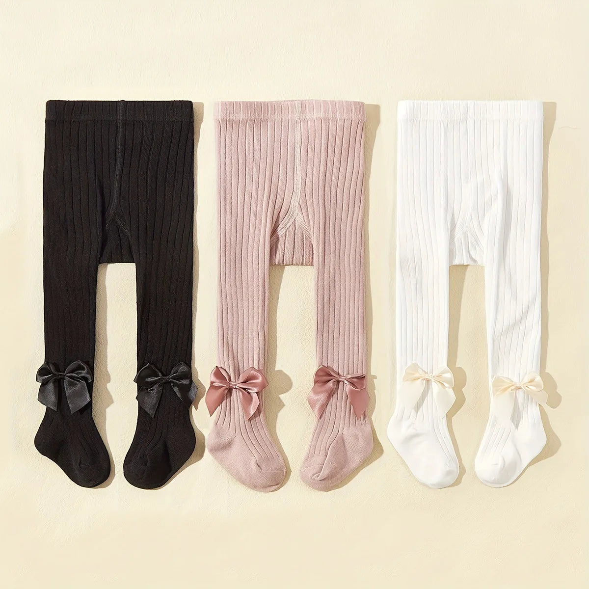 Strumpbyxor med rosett i 3-pack