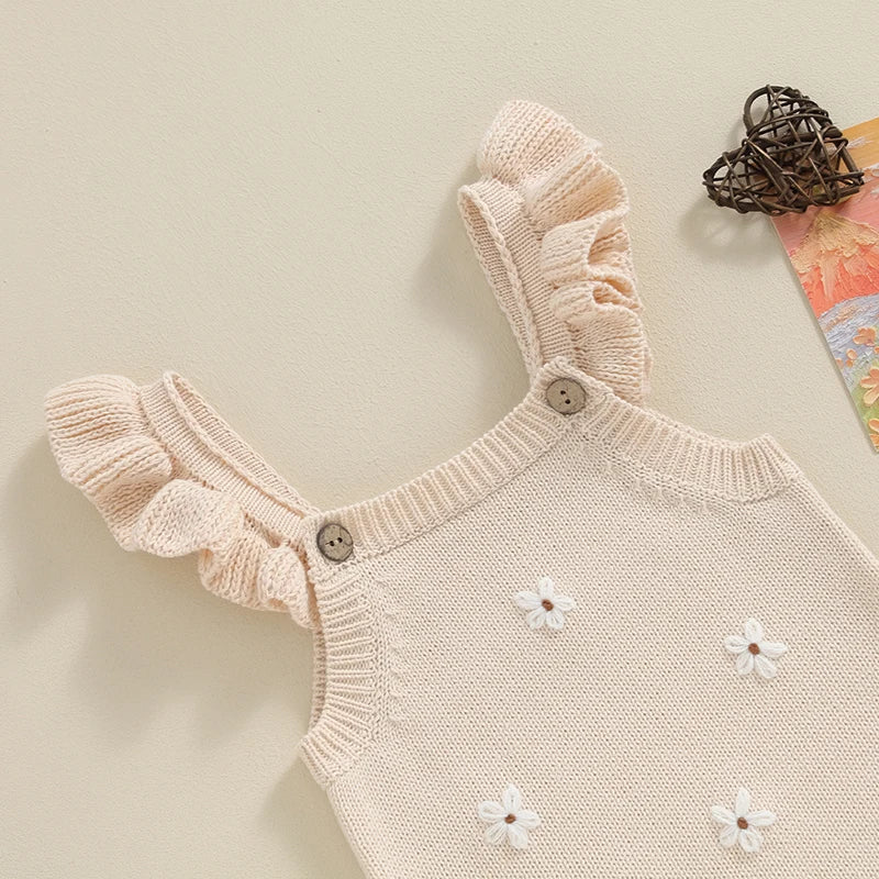 Somrig babyromper med broderade blommor