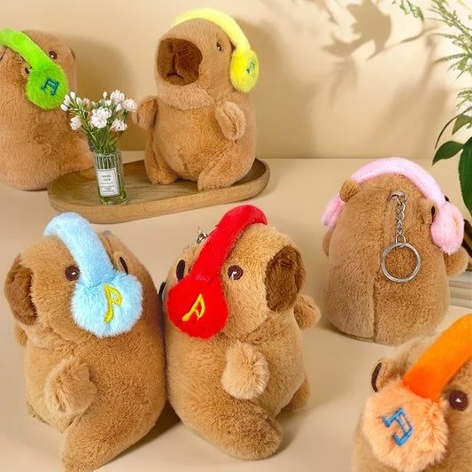 Söt capybara nyckelring med hörlurar