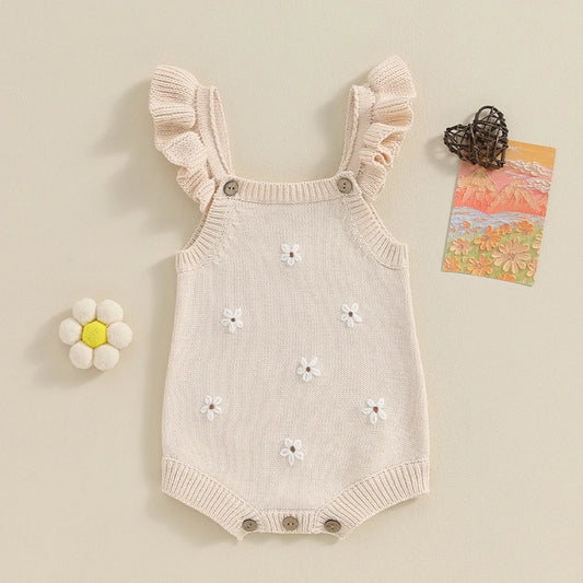 Somrig babyromper med broderade blommor