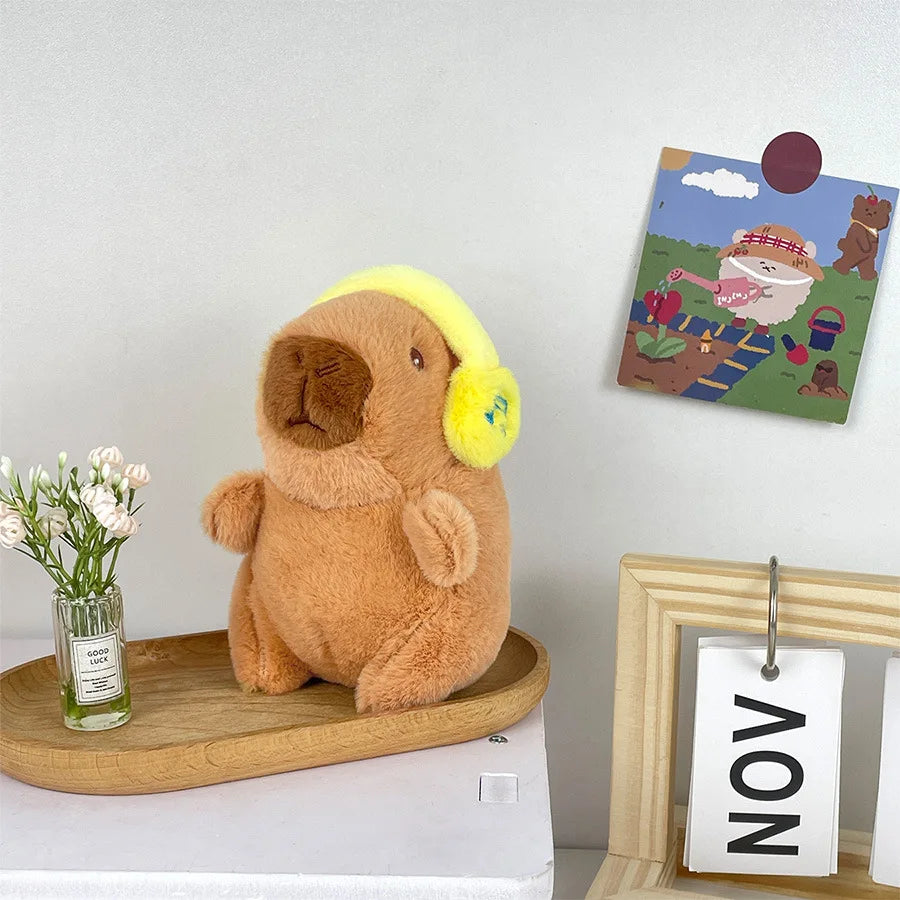 Söt capybara nyckelring med hörlurar