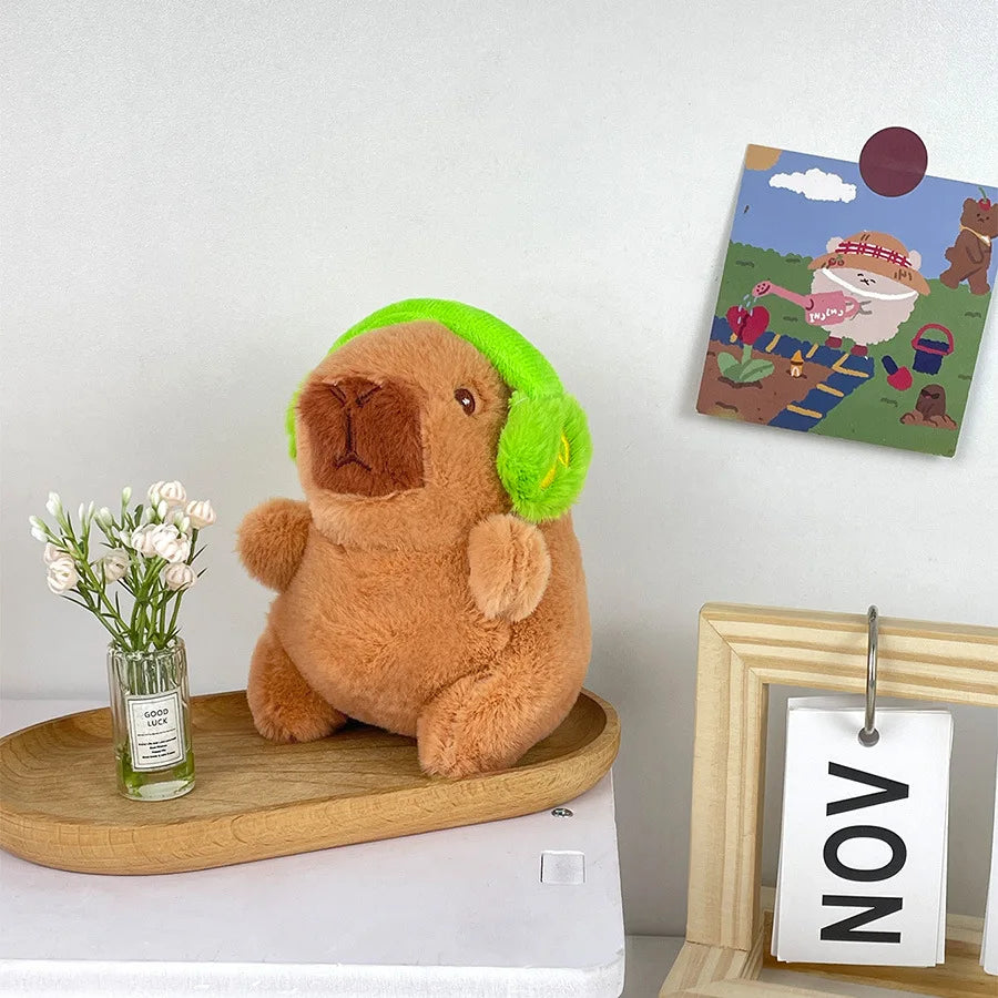 Söt capybara nyckelring med hörlurar