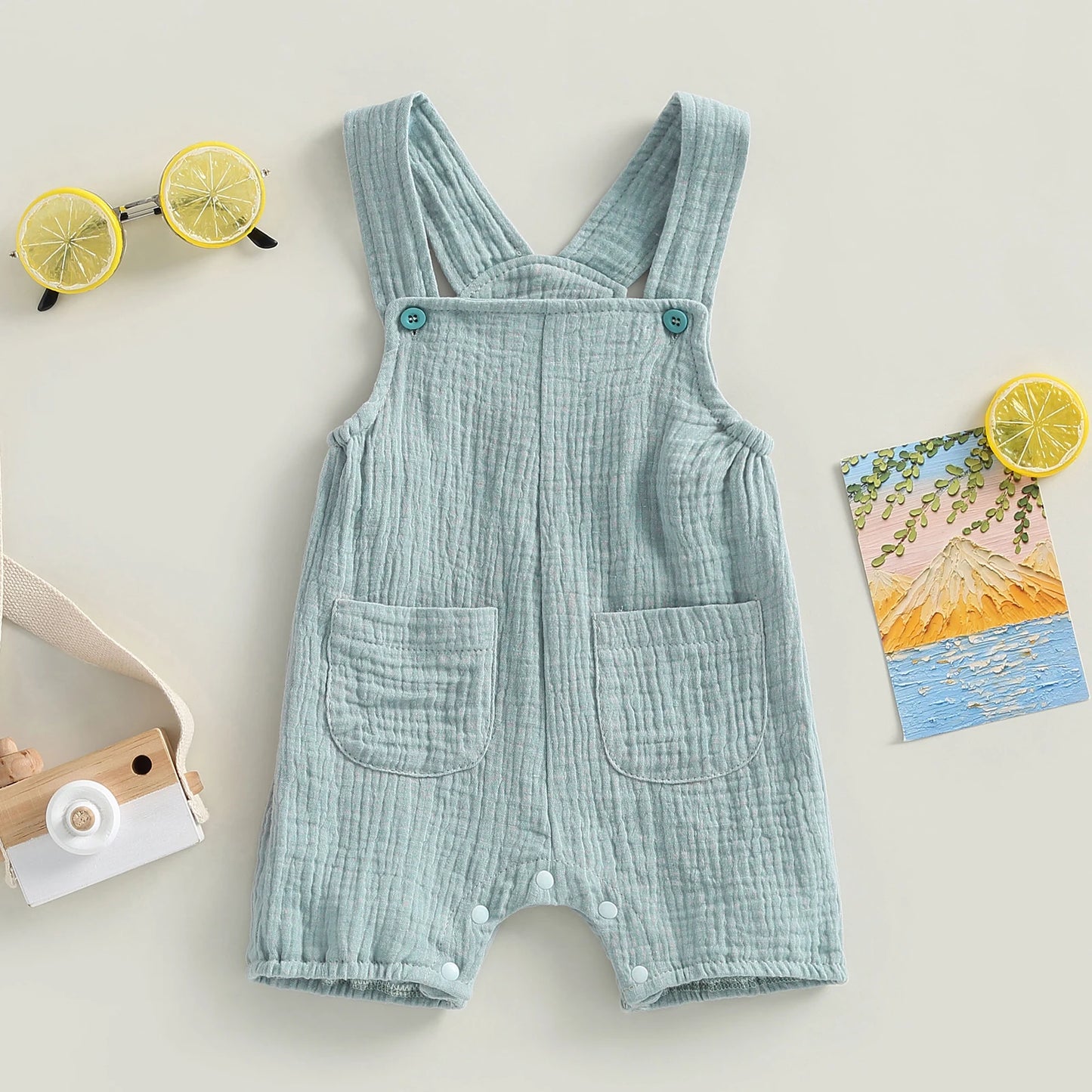 Somrig babyromper med hängslen