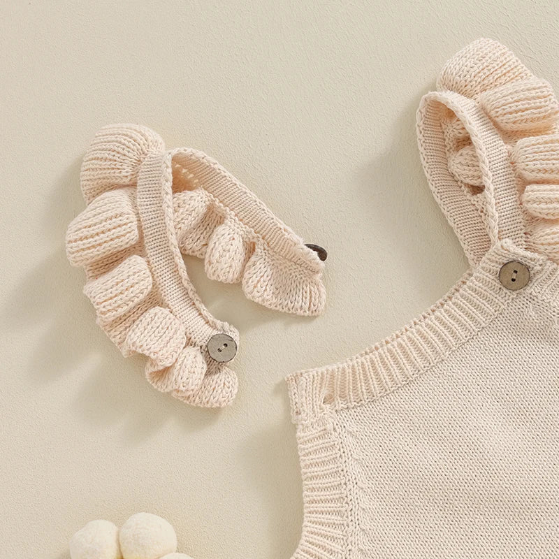 Somrig babyromper med broderade blommor