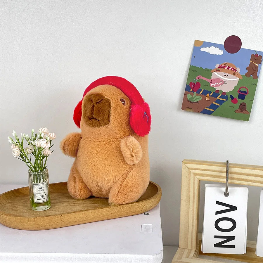 Söt capybara nyckelring med hörlurar