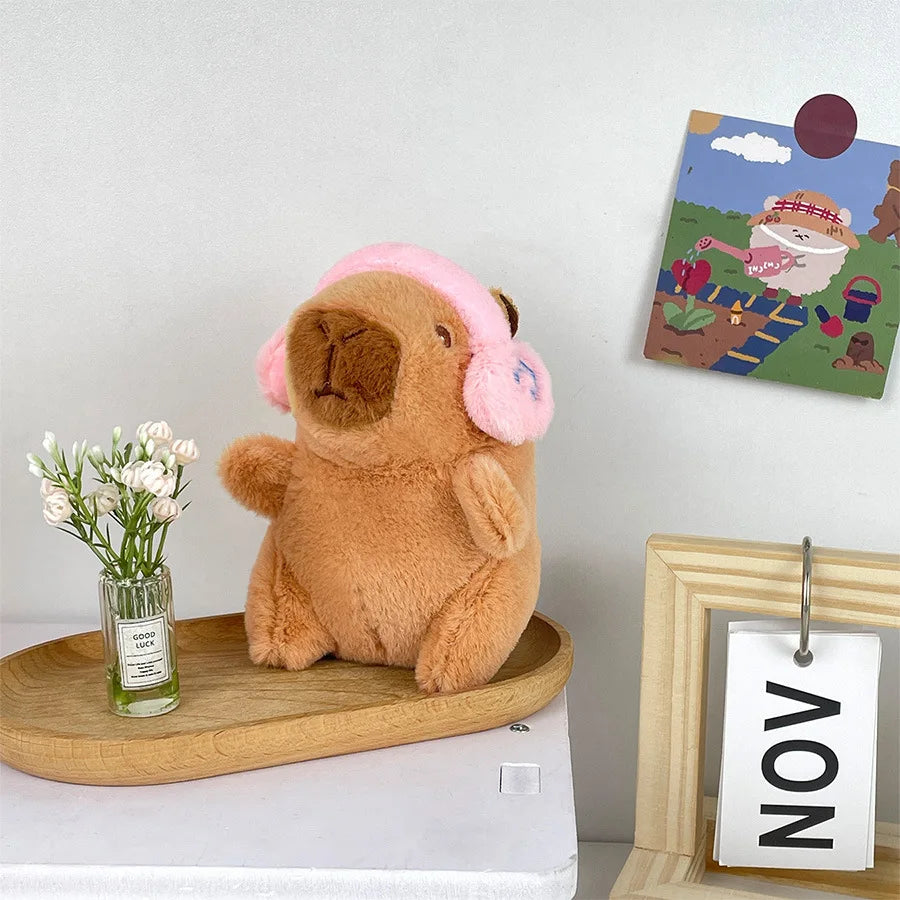 Söt capybara nyckelring med hörlurar