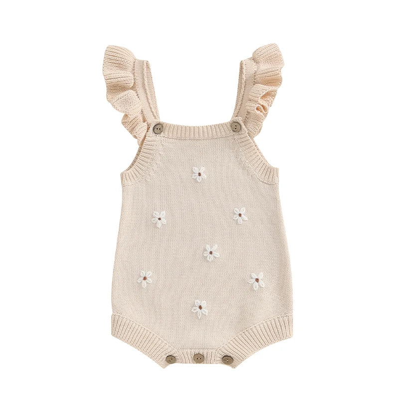 Somrig babyromper med broderade blommor