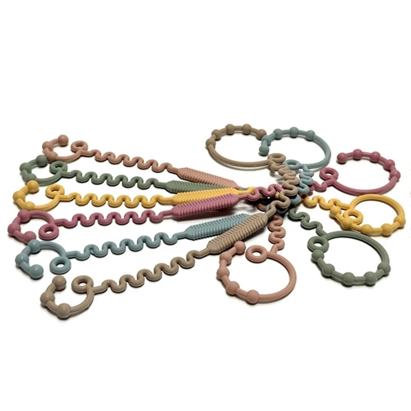 Justerbar silikonrem för nappflaska, napp eller leksak