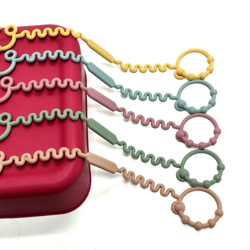 Justerbar silikonrem för nappflaska, napp eller leksak