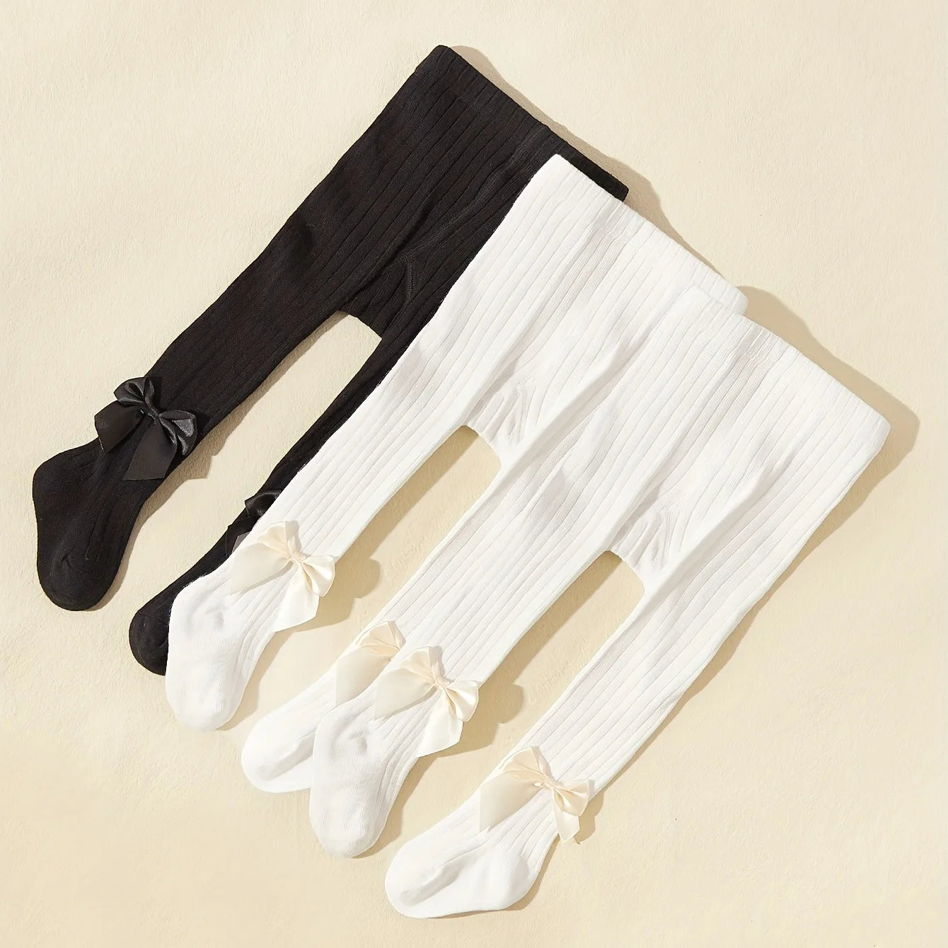 Strumpbyxor med rosett i 3-pack