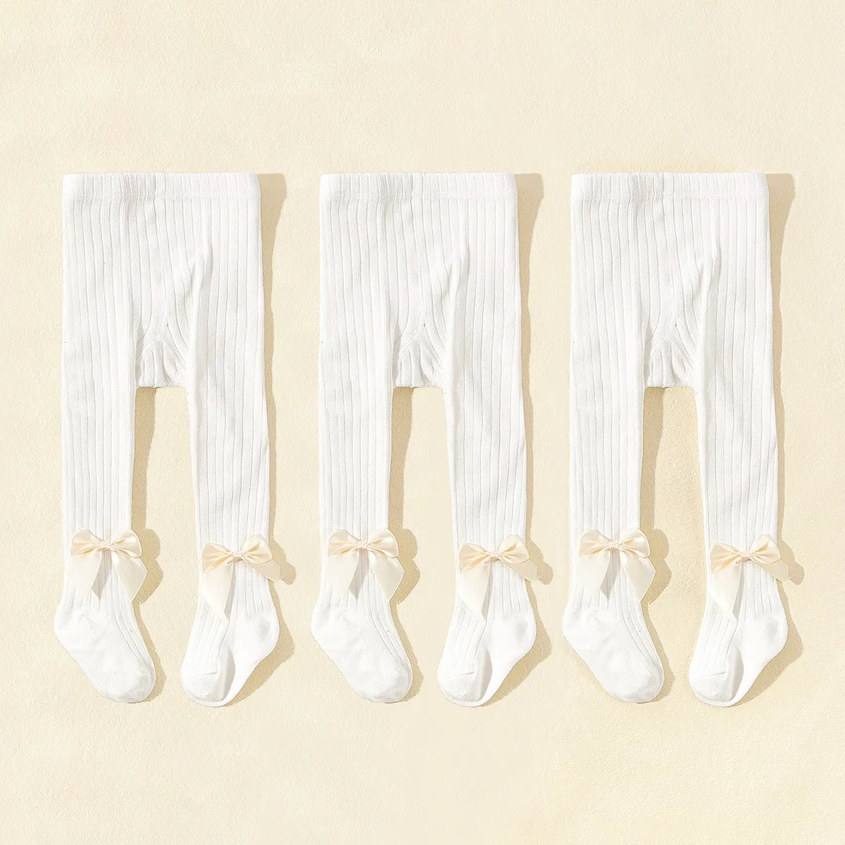 Strumpbyxor med rosett i 3-pack