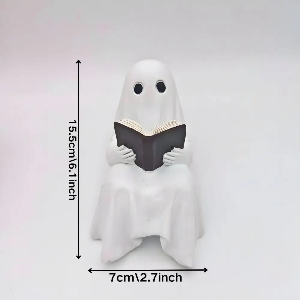 Liten spökskulptur med bok