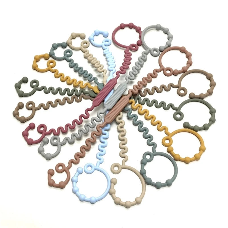 Justerbar silikonrem för nappflaska, napp eller leksak